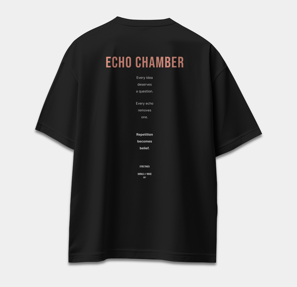 Back of black oversized T-shirt featuring ECHO CHAMBER text about repetition, questions and belief