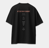 Back of black oversized T-shirt featuring ATTENTION ECONOMY text about attention and memory