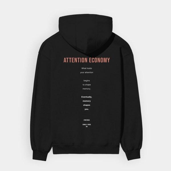 ATTENTION ECONOMY hoodie back featuring conceptual text about attention and memory